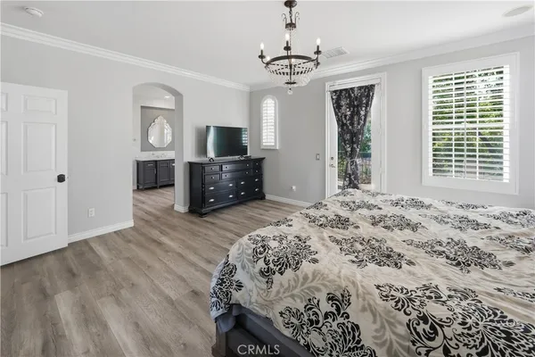 a spacious bathroom with a granite countertop tub a double vanity sink a mirror and a window