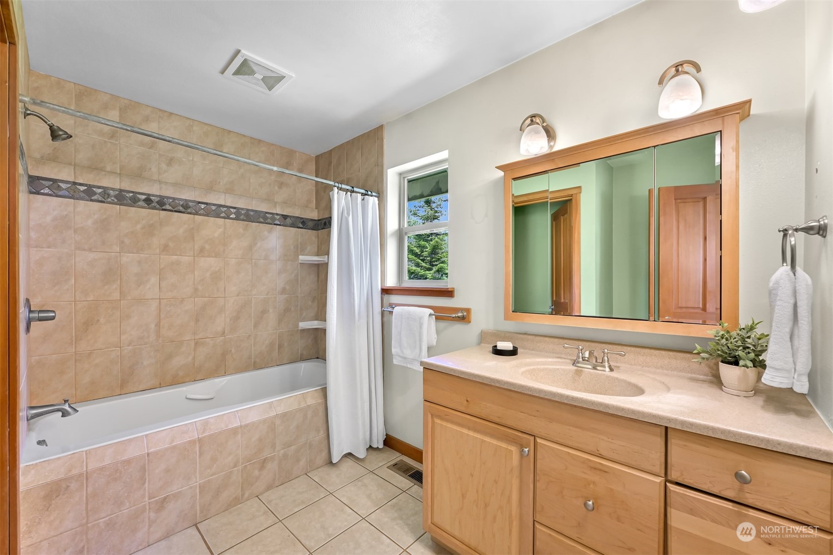 4979 Elder Road Ferndale, WA 98248 - Photo 14 of 24 a bathroom with a tub sink shower and mirror