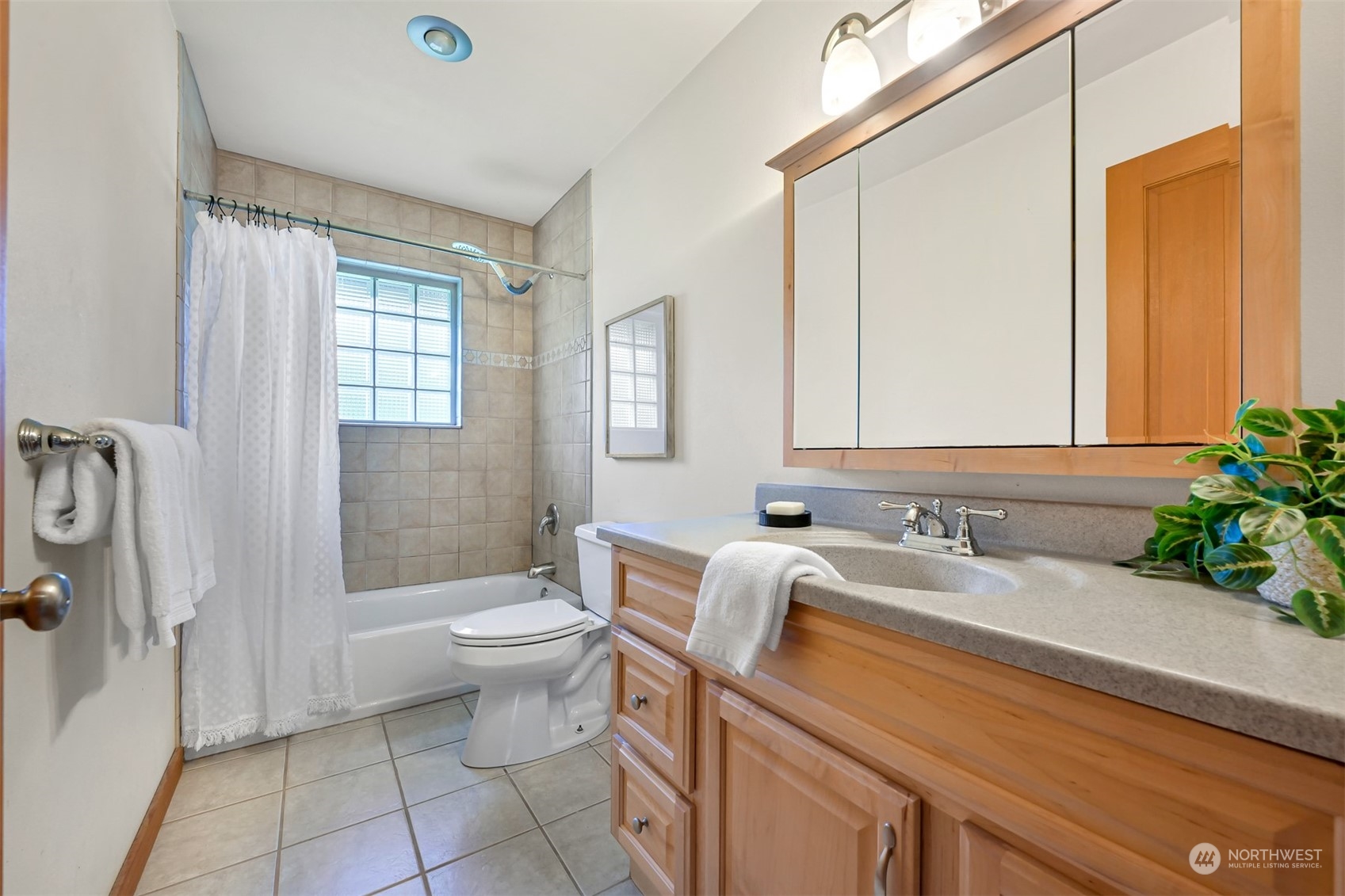 4979 Elder Road Ferndale, WA 98248 - Photo 17 of 24 a bathroom with a granite countertop sink mirror vanity and toilet