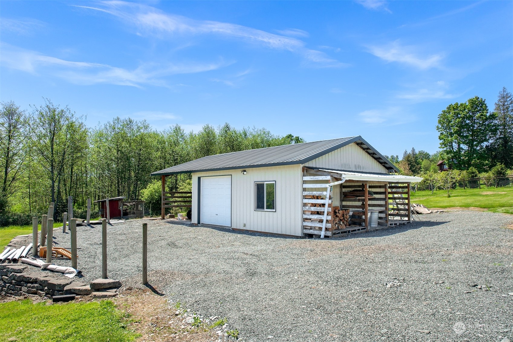 4979 Elder Road Ferndale, WA 98248 - Photo 22 of 24 a view of a house with backyard and trees