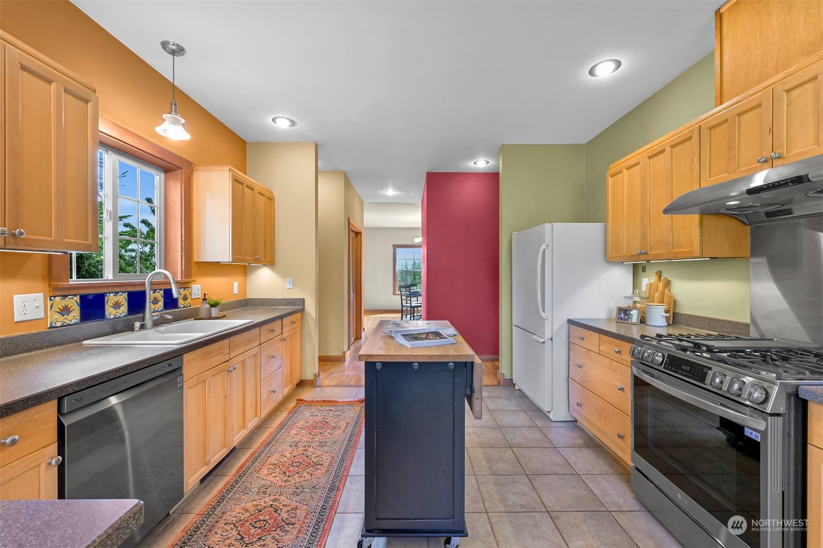 4979 Elder Road Ferndale, WA 98248 - Photo 3 of 24 a kitchen with stainless steel appliances granite countertop a stove a sink dishwasher and a refrigerator
