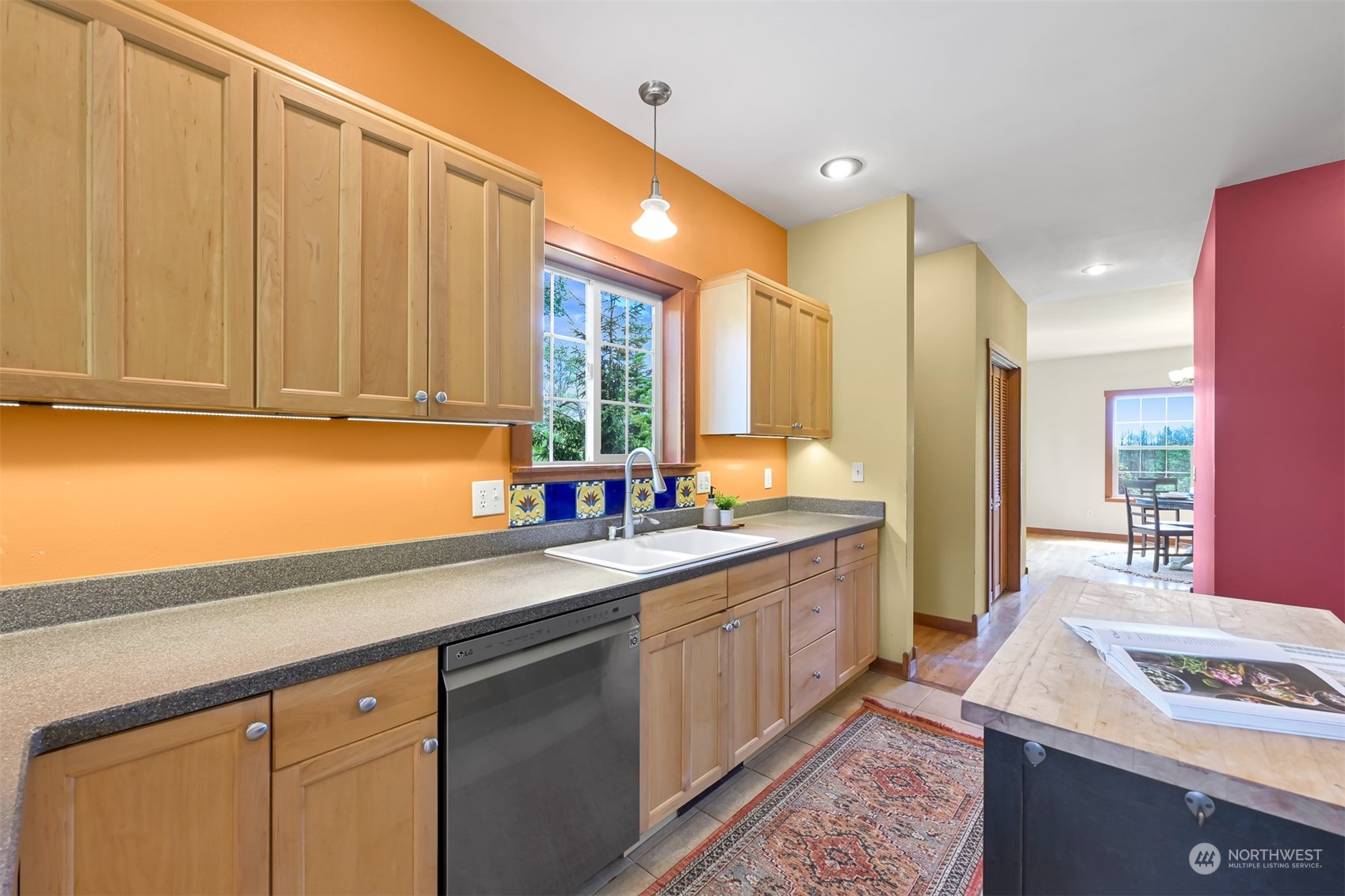 4979 Elder Road Ferndale, WA 98248 - Photo 4 of 24 a kitchen with kitchen island granite countertop a sink stainless steel appliances and cabinets