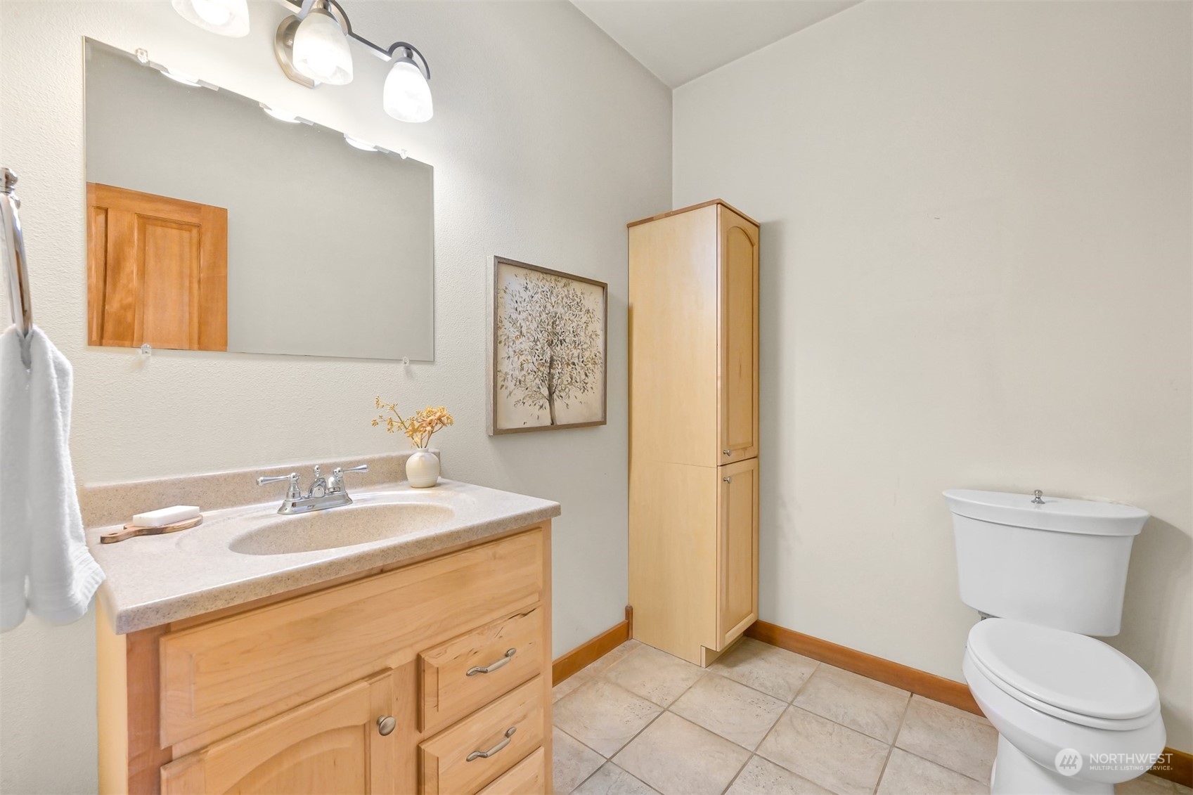 4979 Elder Road Ferndale, WA 98248 - Photo 8 of 24 a bathroom with a sink a toilet and mirror