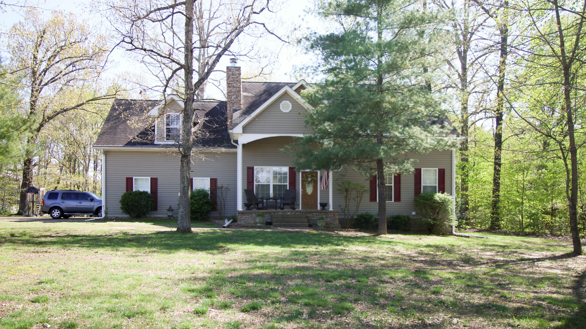 a front view of a house with a yard