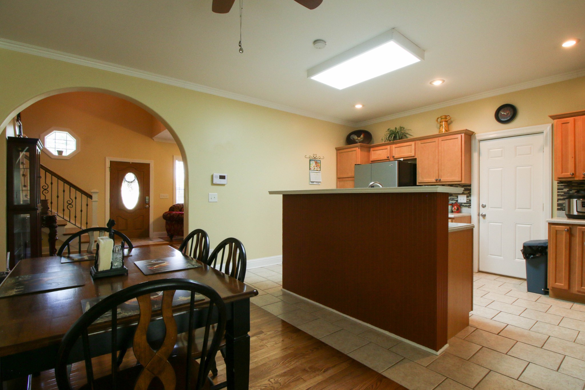 1783 Friendship Road Cross Plains, TN 37049 - Photo 12 of 24 a kitchen with stainless steel appliances granite countertop a refrigerator a stove and a dining table with wooden floor