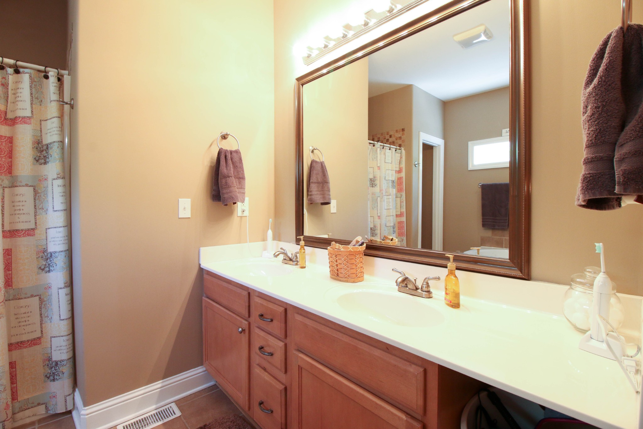 1783 Friendship Road Cross Plains, TN 37049 - Photo 17 of 24 a bathroom with a double vanity sink and a mirror