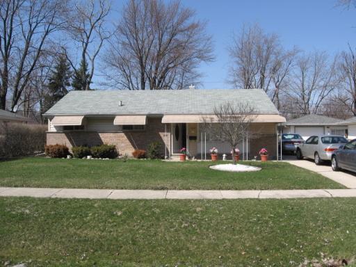 162 Monee Road Park Forest, IL 60466 - Photo 1 of 1 a front view of a house with a garden