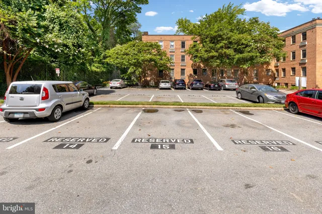a view of street with parked cars