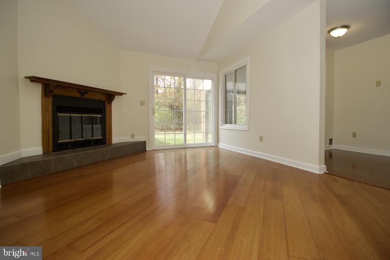 305 Pine Valley Road Dover, DE 19904 - Photo 19 of 37 wooden floor in an empty room with a window