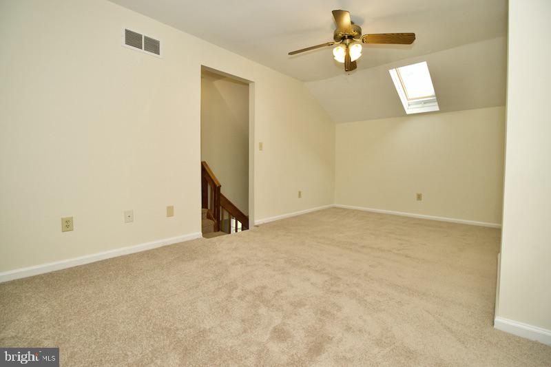 305 Pine Valley Road Dover, DE 19904 - Photo 23 of 37 an empty room with ceiling fan and window