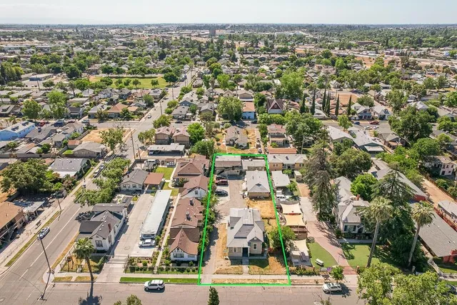 an aerial view of residential houses with outdoor space