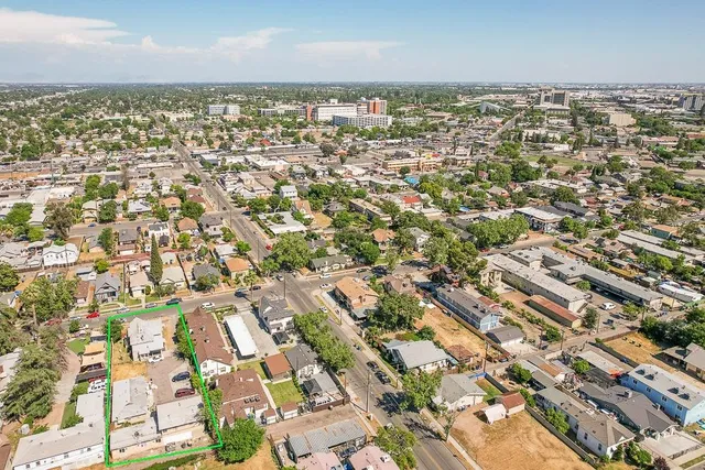 an aerial view of residential building with parking space