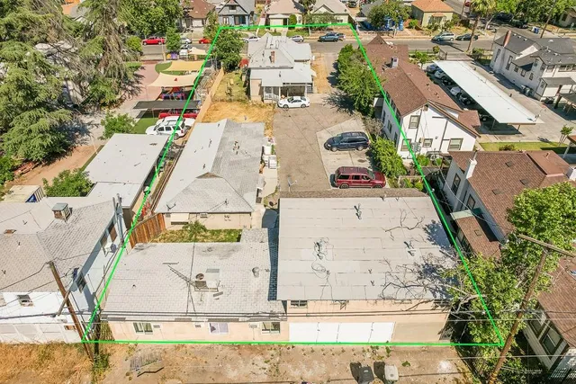 an aerial view of residential houses with outdoor space