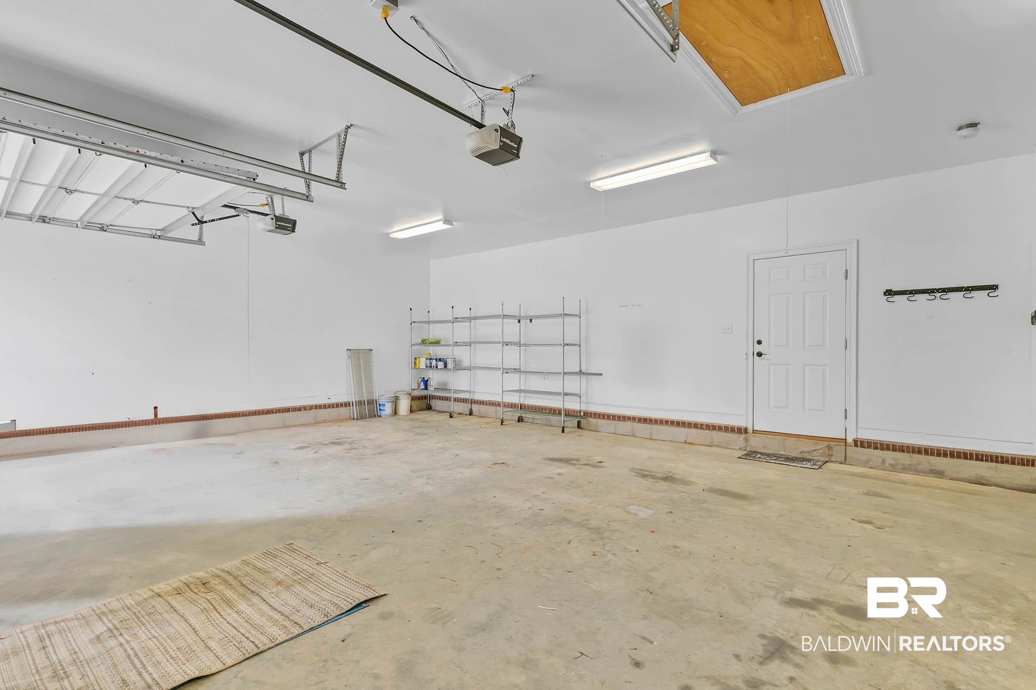 8145 Bay View Drive Foley, AL 36535 - Photo 52 of 81 Garage with a garage door opener