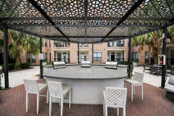 a outdoor space with a large window and furniture