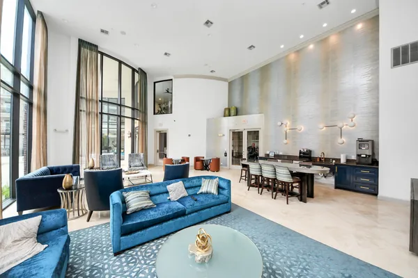 a living room with furniture or couch and a large window