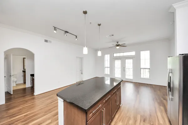 a view of a kitchen with a sink and dishwasher wooden floor