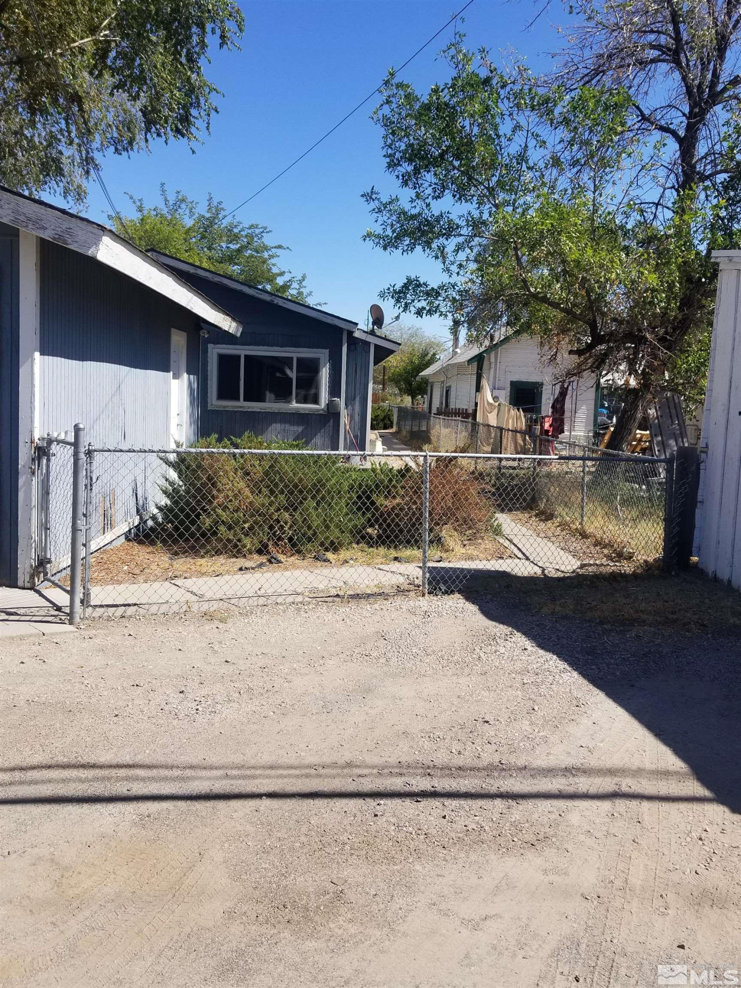 250-252 South Taylor Street Fallon, NV 89406 - Photo 28 of 29 a view of a house with a yard
