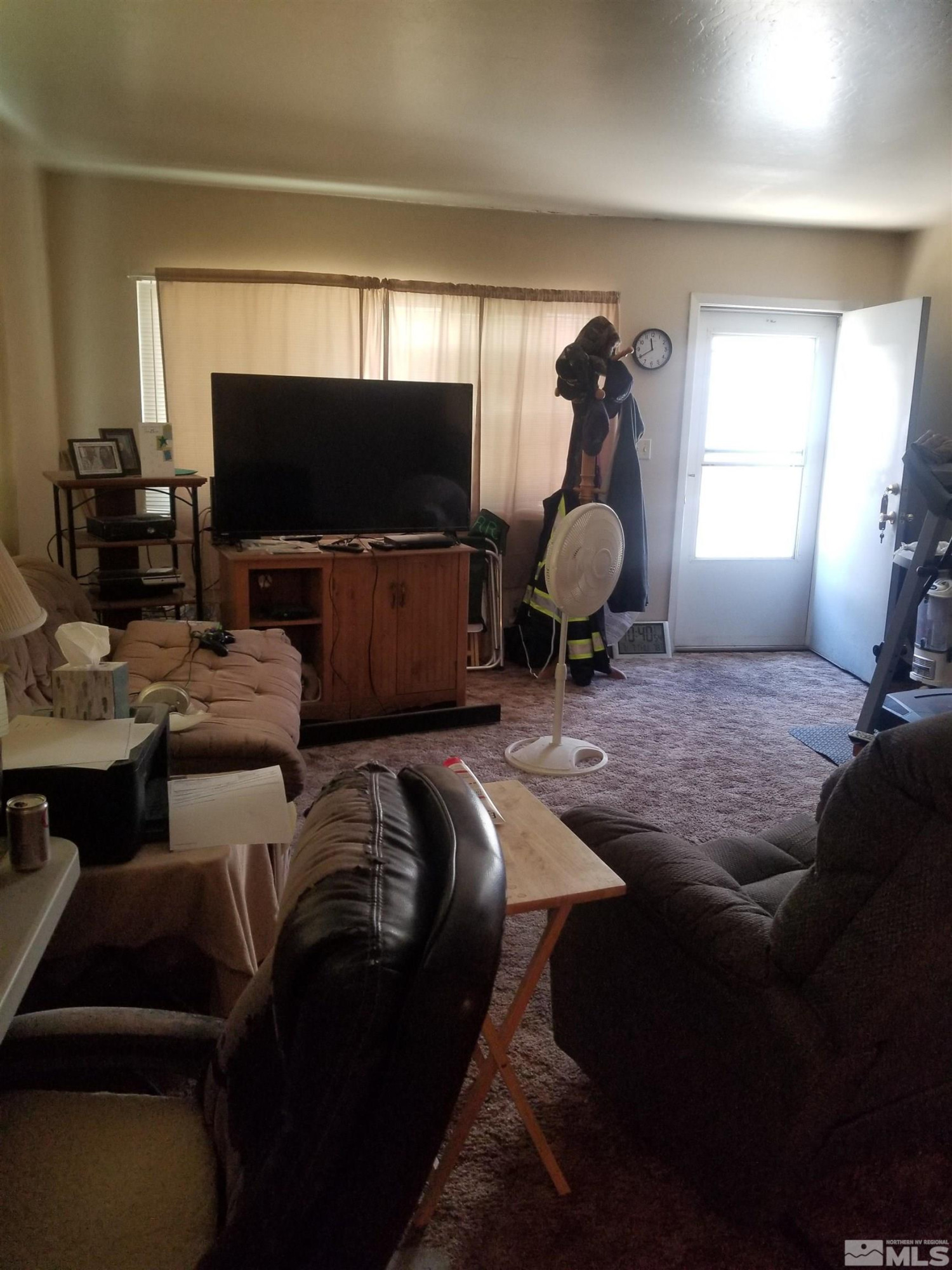 250-252 South Taylor Street Fallon, NV 89406 - Photo 8 of 29 a living room with furniture a flat screen tv and a fireplace