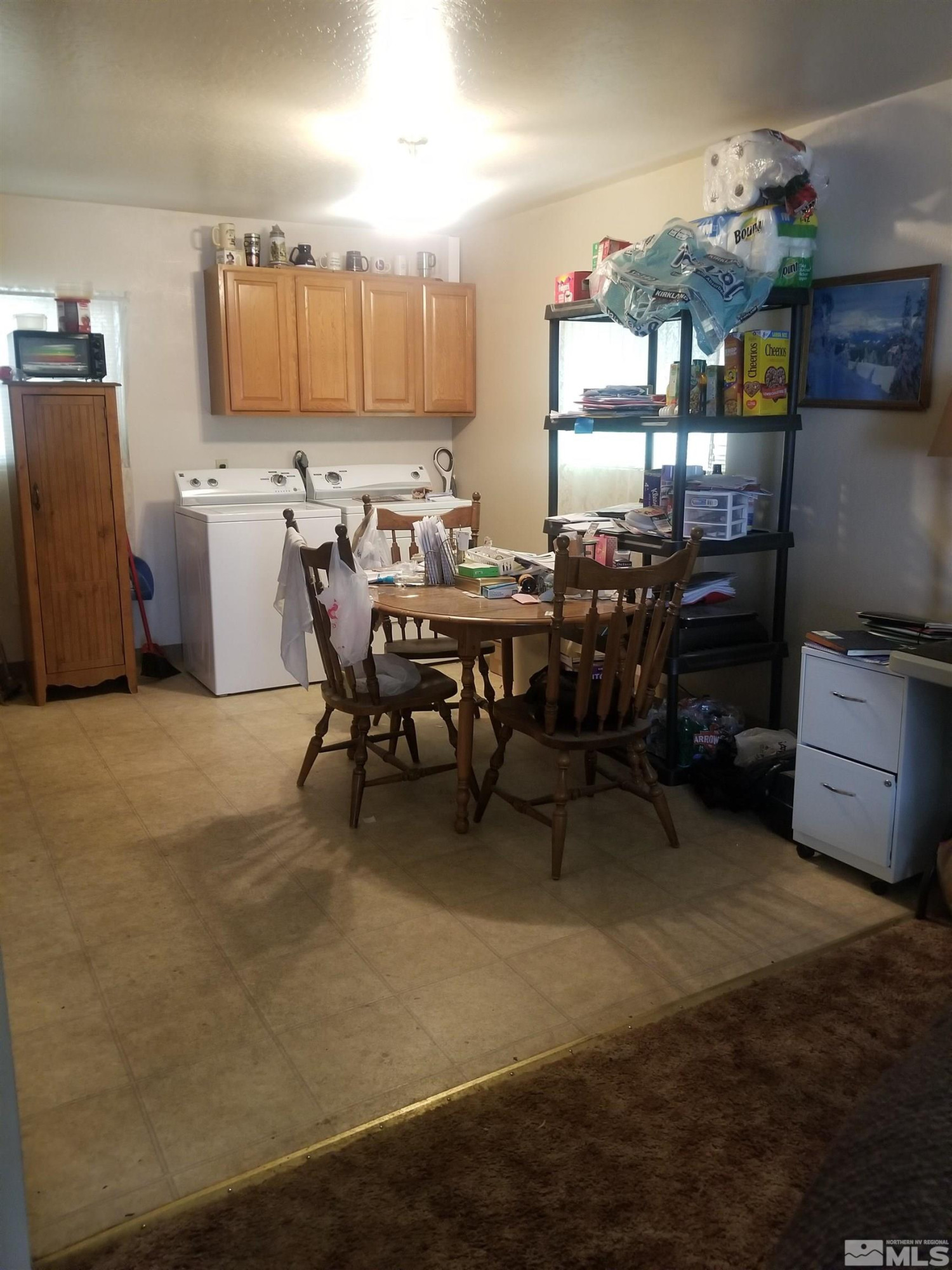 250-252 South Taylor Street Fallon, NV 89406 - Photo 10 of 29 a kitchen with a sink and a stove top oven