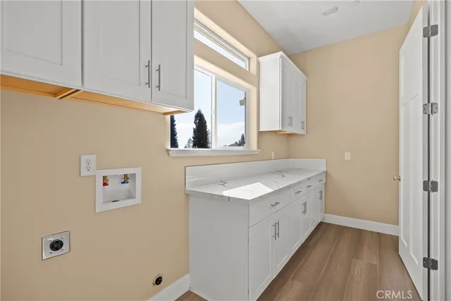 a bathroom with a toilet sink vanity and mirror