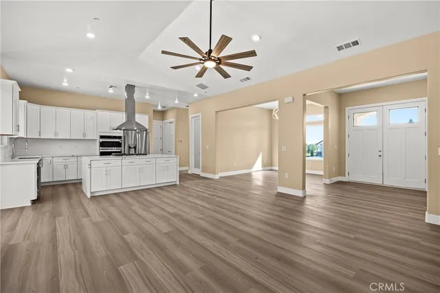 a view of a kitchen with furniture and a fireplace