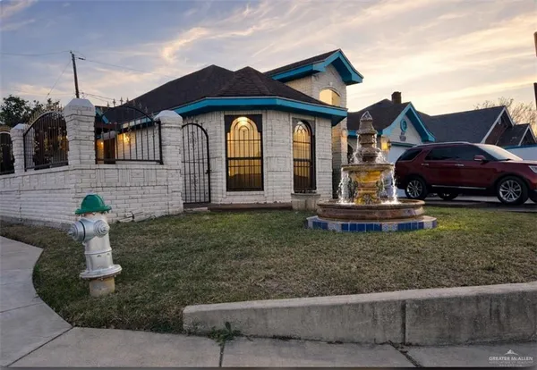 a front view of a house with garden