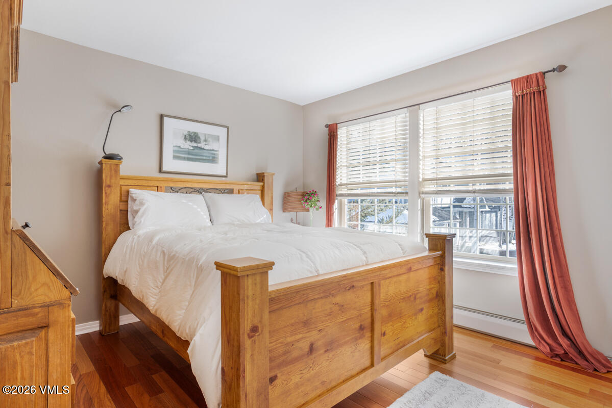 288 Edwards Village Boulevard, Unit 6A Edwards, CO 81632 - Photo 23 of 36 a bed sitting in a bedroom next to a window