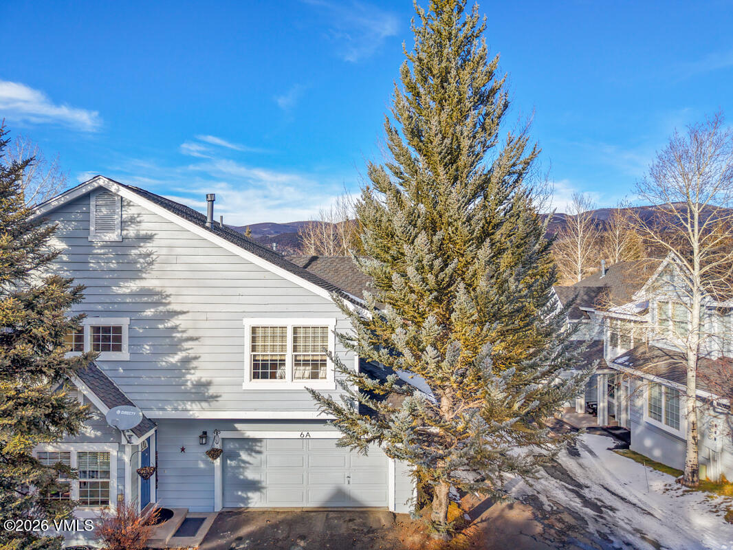 288 Edwards Village Boulevard, Unit 6A Edwards, CO 81632 - Photo 31 of 36 a view of a house with a yard