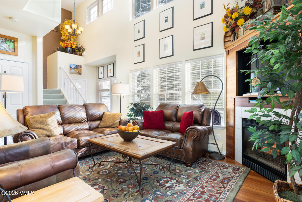 288 Edwards Village Boulevard, Unit 6A Edwards, CO 81632 - Photo 4 of 36 a living room with furniture and a potted plant