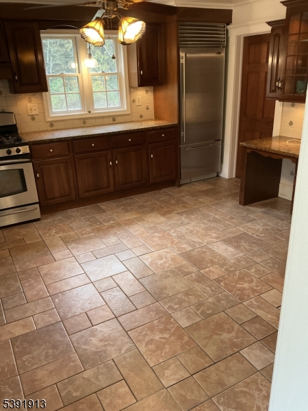 100 La Rue Road West Milford, NJ 07435 - Photo 3 of 13 a kitchen with stainless steel appliances a sink and cabinets