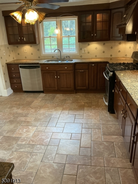 100 La Rue Road West Milford, NJ 07435 - Photo 4 of 13 a large kitchen with granite countertop a stove a sink a counter space and cabinets