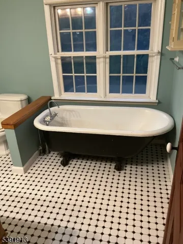a bathroom with a bathtub and shower