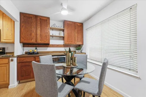 a kitchen with a table chairs and a stove
