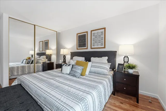 a bedroom with a bed and a closet