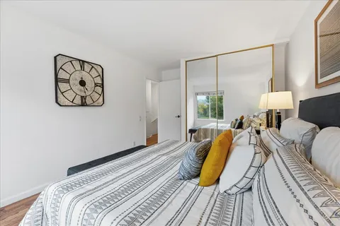 a bed room with a bed and a lamp