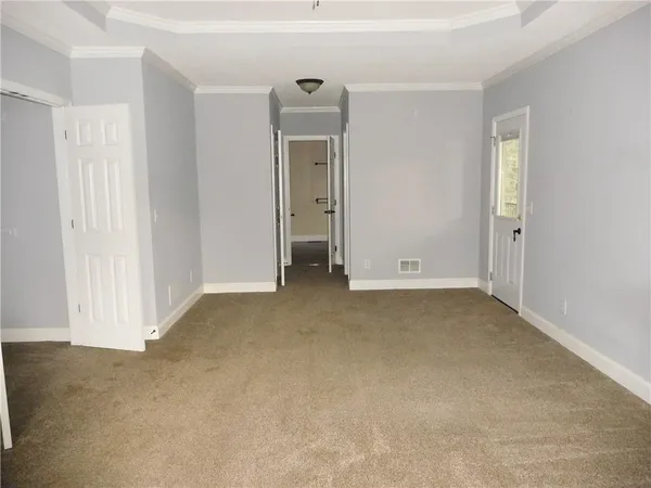 a view of an empty room with a window