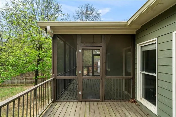 a view of a deck with a backyard