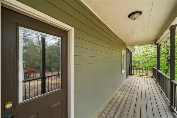 a view of balcony with wooden floor
