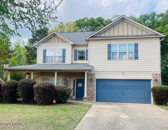 121 Presidents Way Forsyth, GA 31029 - Photo 1 of 25 a front view of a house with a yard