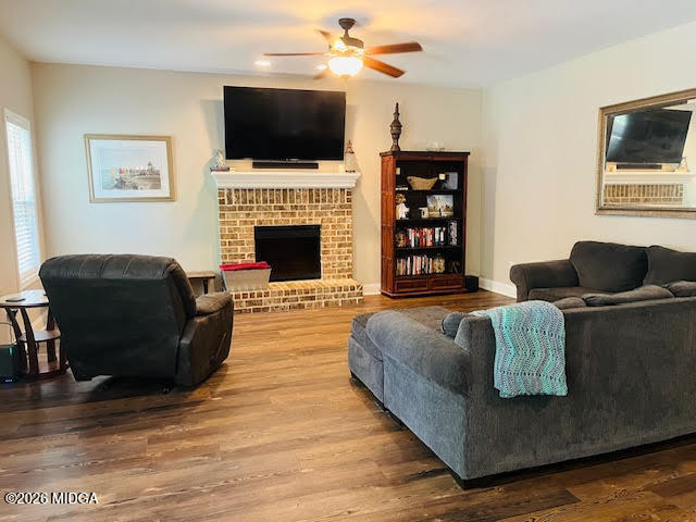 121 Presidents Way Forsyth, GA 31029 - Photo 12 of 25 a living room with furniture a flat screen tv and a fireplace