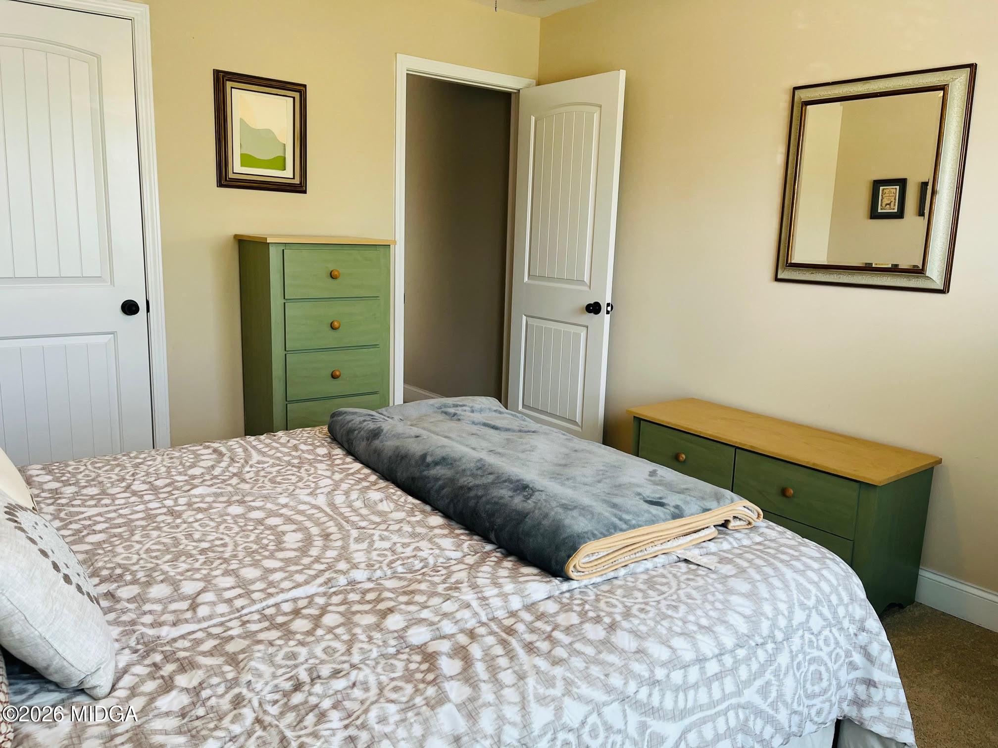 121 Presidents Way Forsyth, GA 31029 - Photo 16 of 25 a bedroom with a bed and a window