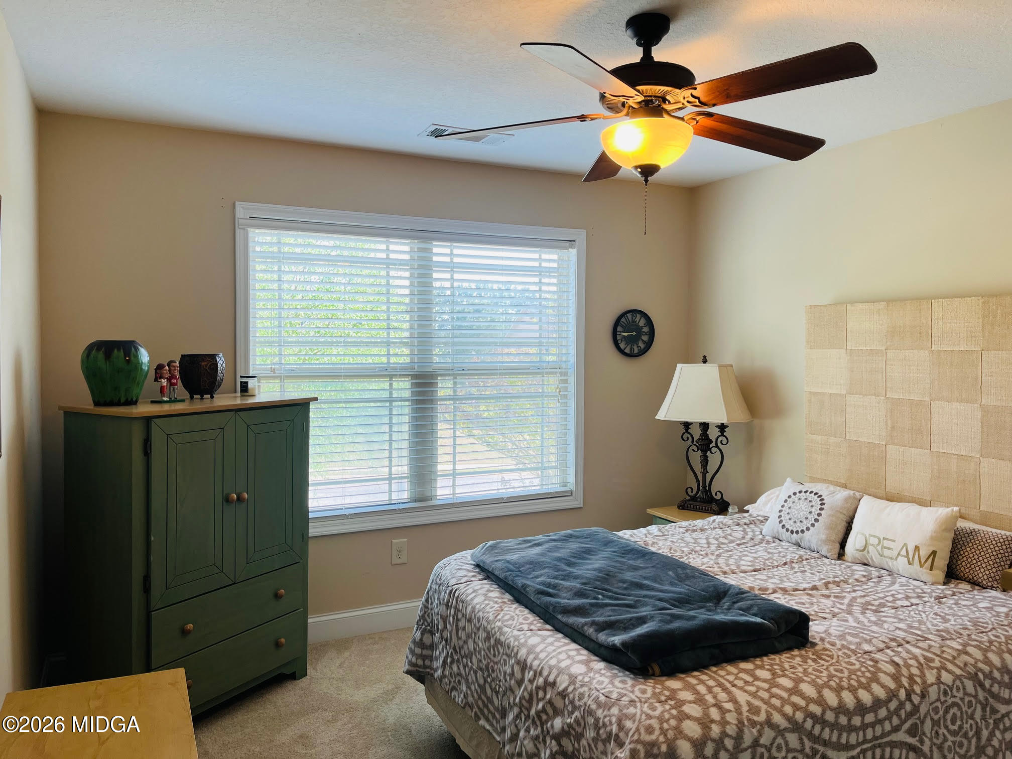 121 Presidents Way Forsyth, GA 31029 - Photo 17 of 25 a bedroom with a bed and a window
