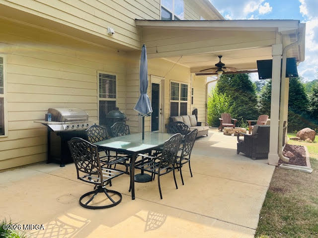 121 Presidents Way Forsyth, GA 31029 - Photo 22 of 25 a view of a patio with table and chairs