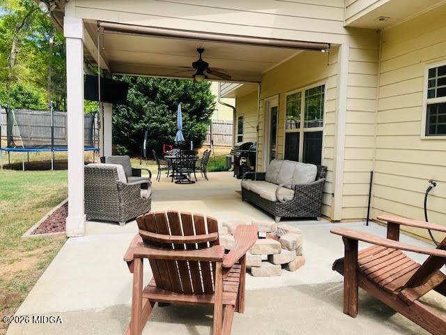 121 Presidents Way Forsyth, GA 31029 - Photo 23 of 25 a view of a patio with couches chairs dining table and chairs