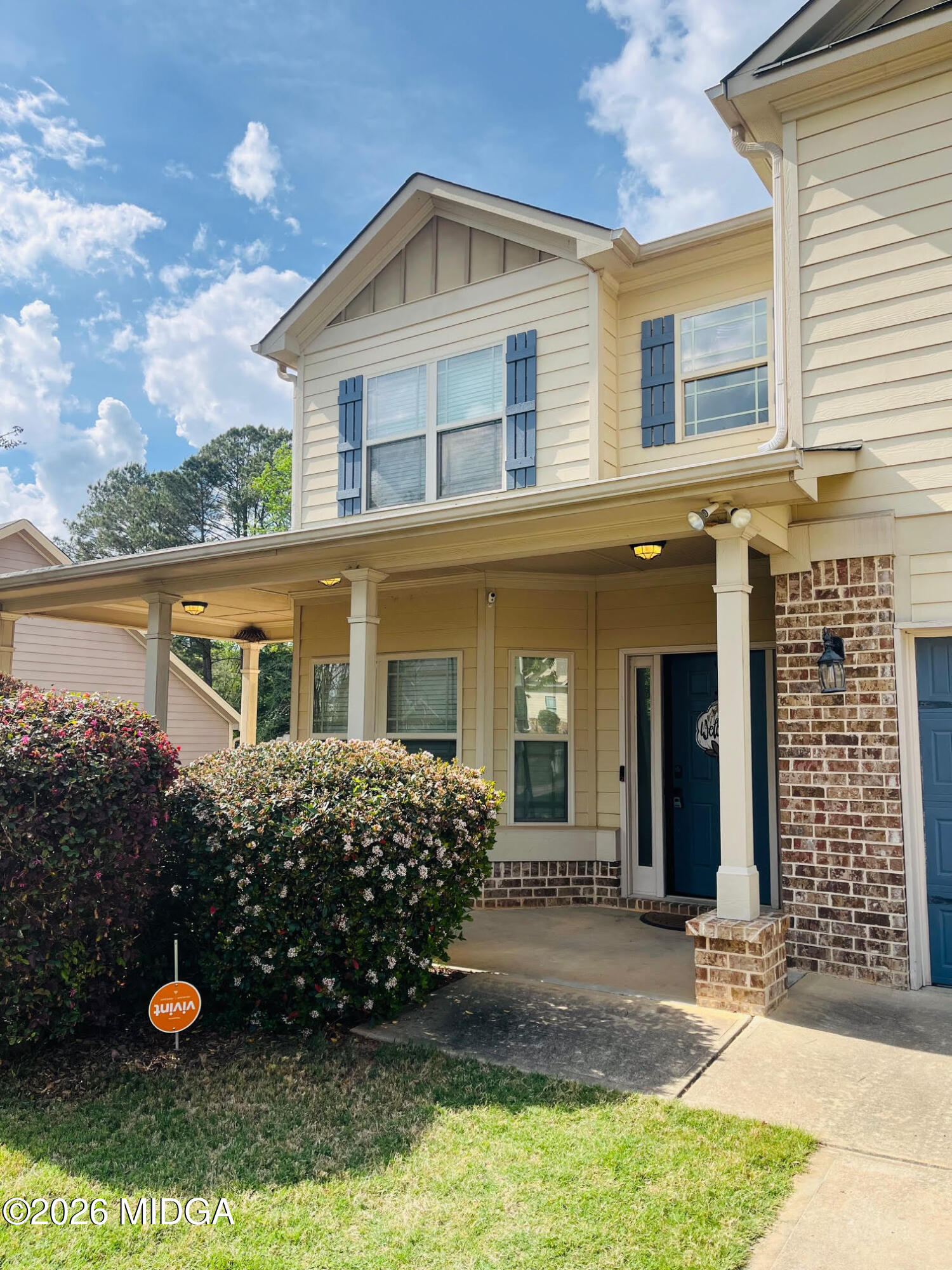 121 Presidents Way Forsyth, GA 31029 - Photo 3 of 25 a front view of a house with a yard
