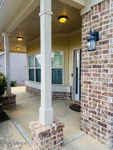 121 Presidents Way Forsyth, GA 31029 - Photo 4 of 25 a view of a entryway door front of house