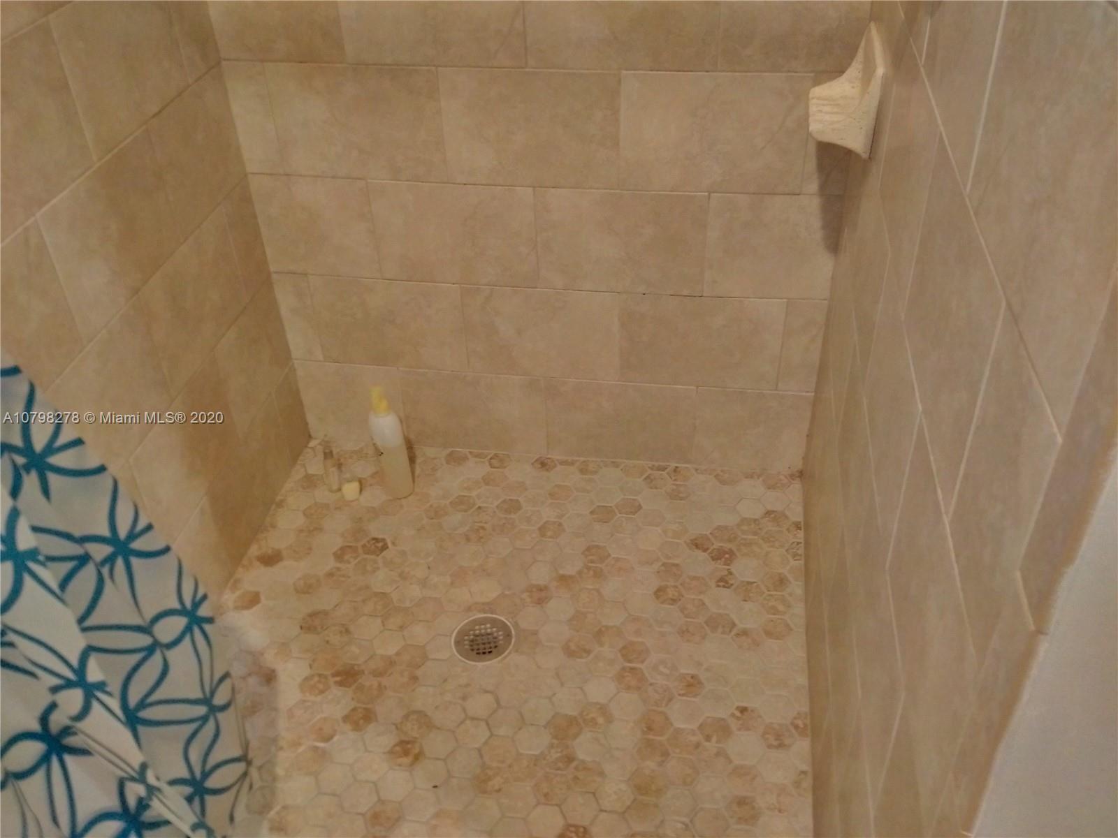 13060 Southwest 263rd Terrace Homestead, FL 33032 - Photo 14 of 28 a bathroom with a shower
