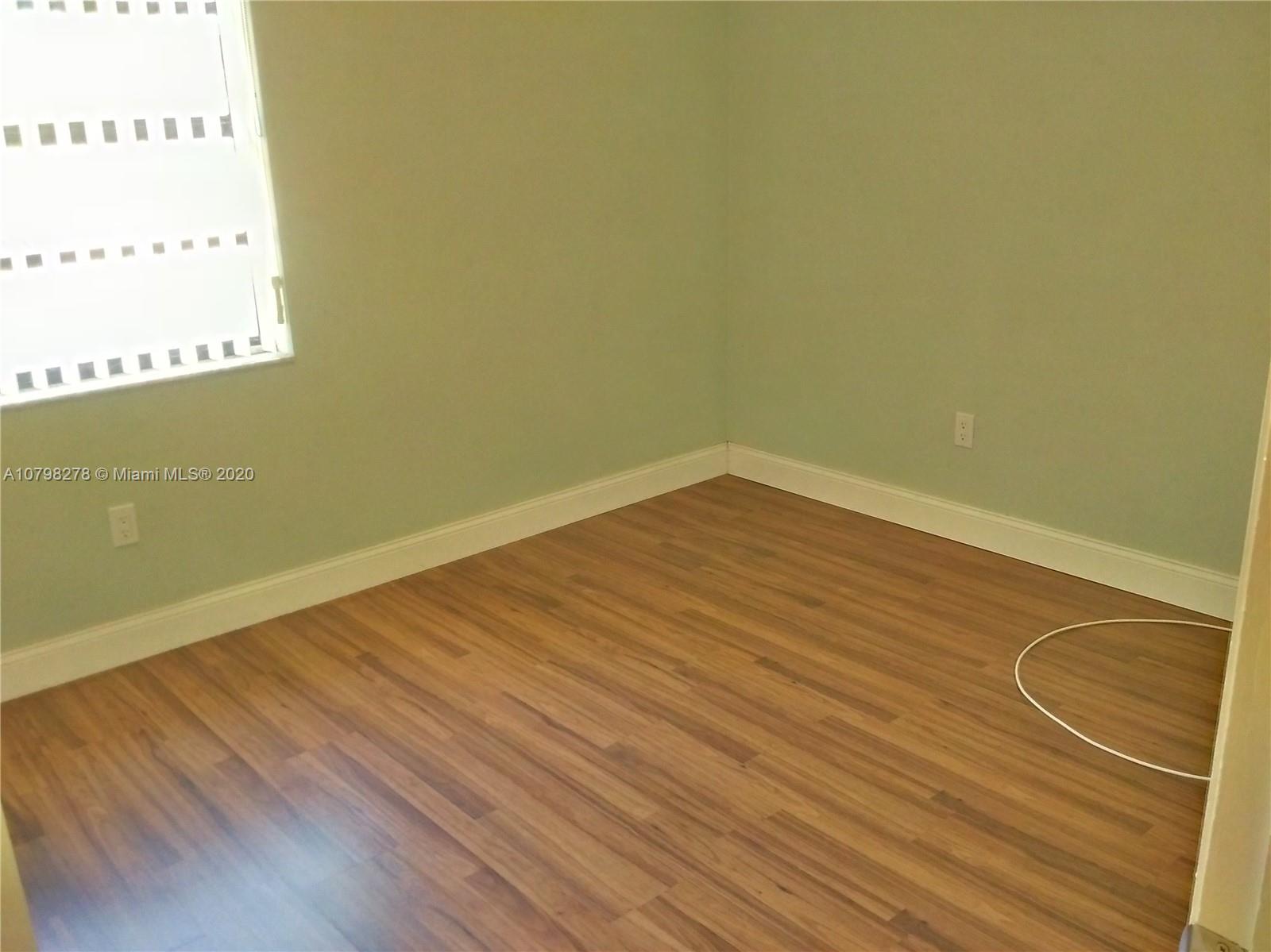 13060 Southwest 263rd Terrace Homestead, FL 33032 - Photo 17 of 28 a view of a room with wooden floor