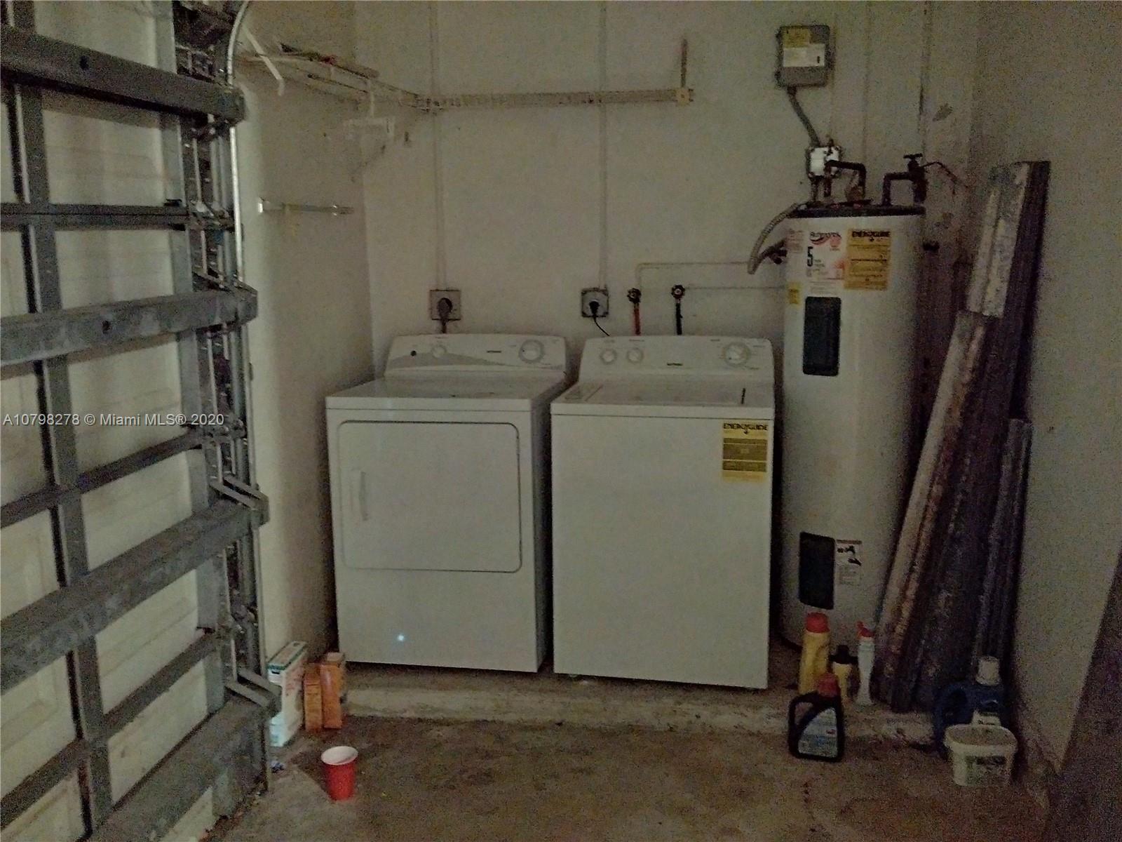 13060 Southwest 263rd Terrace Homestead, FL 33032 - Photo 22 of 28 a utility room with dryer and washer